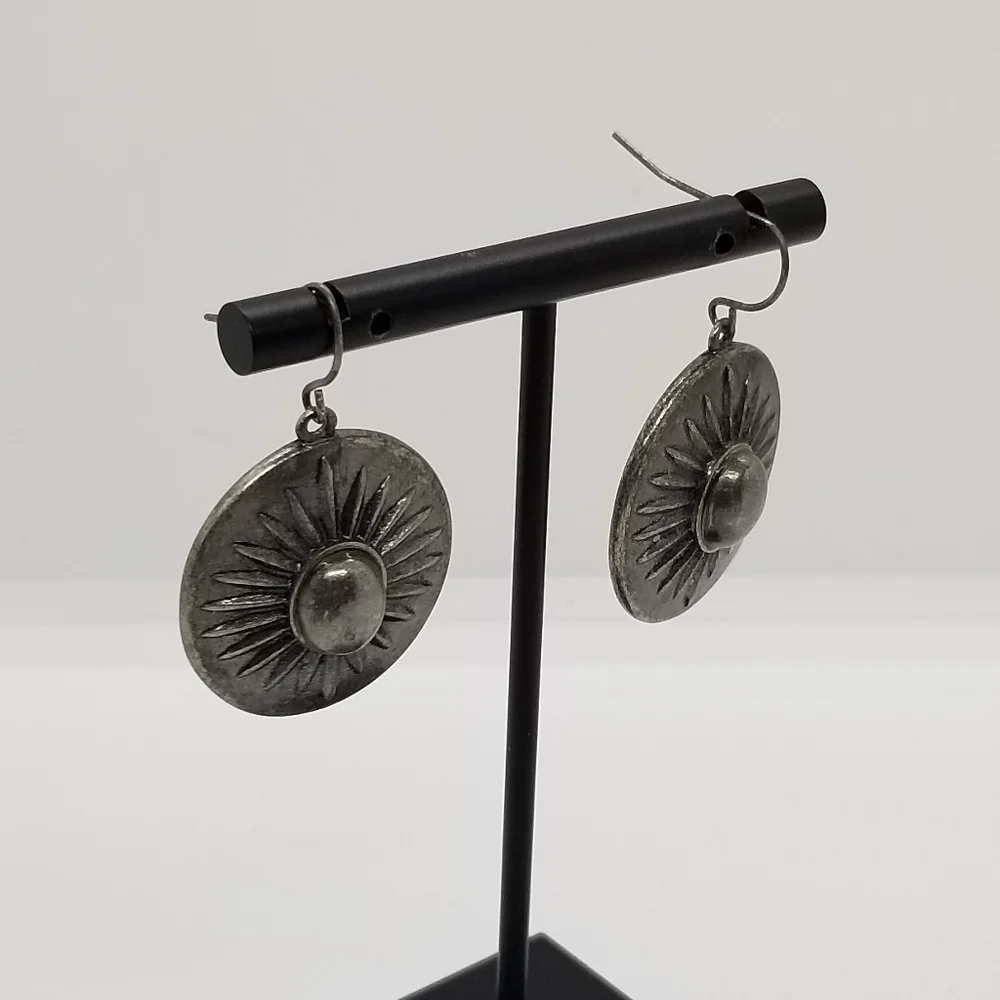 silver tone starburst dangle earrings